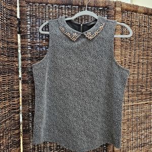 Mottled women's sleeveless black top with embellished collar